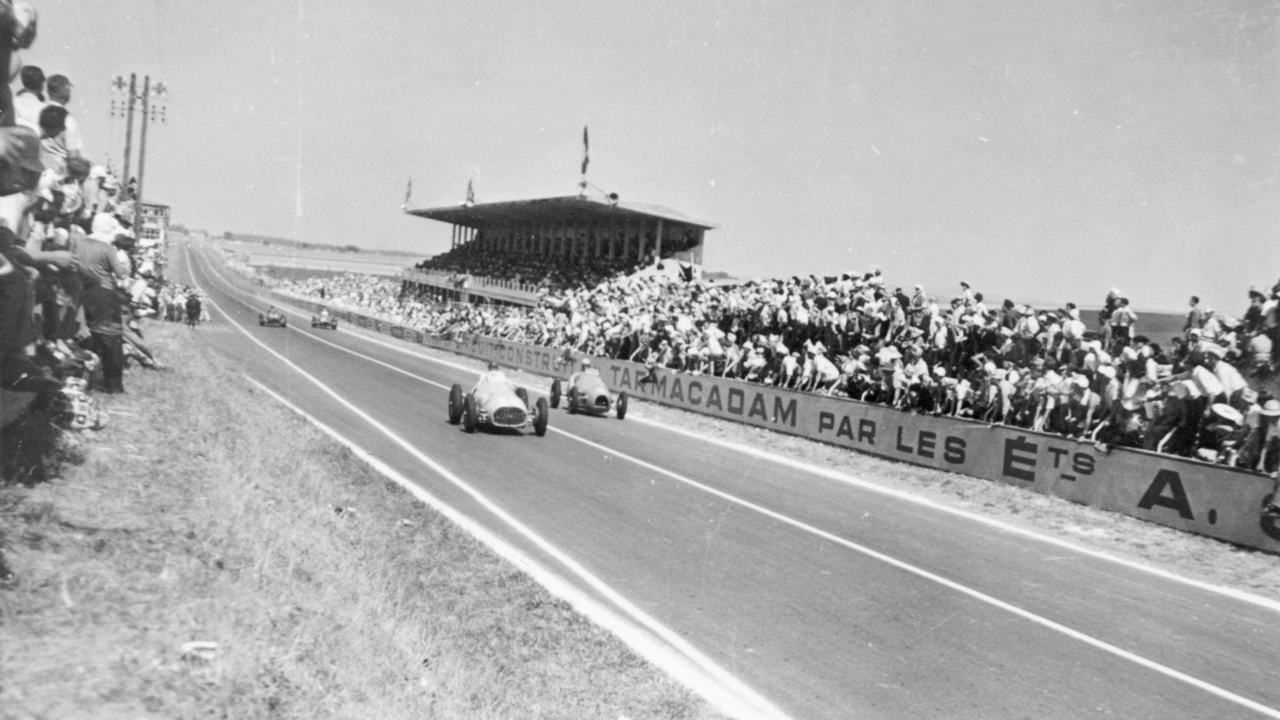 Louis Rosier leads Jean Behra, who would go on to win, at Reims in 1952. 