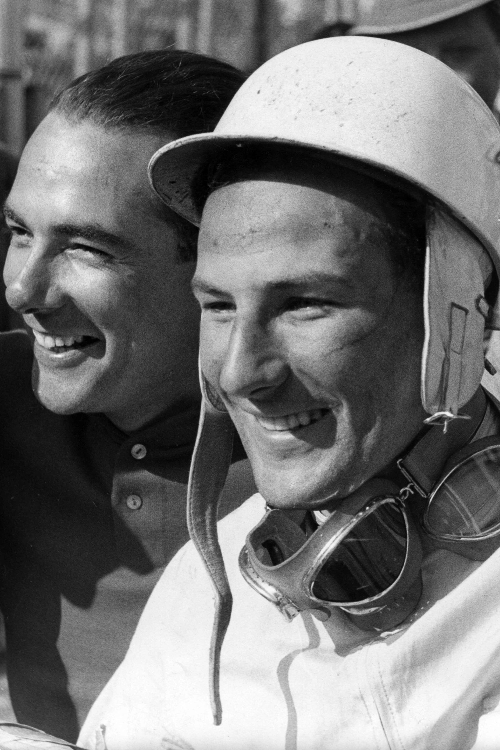 Jean Behra with Stirling Moss. 