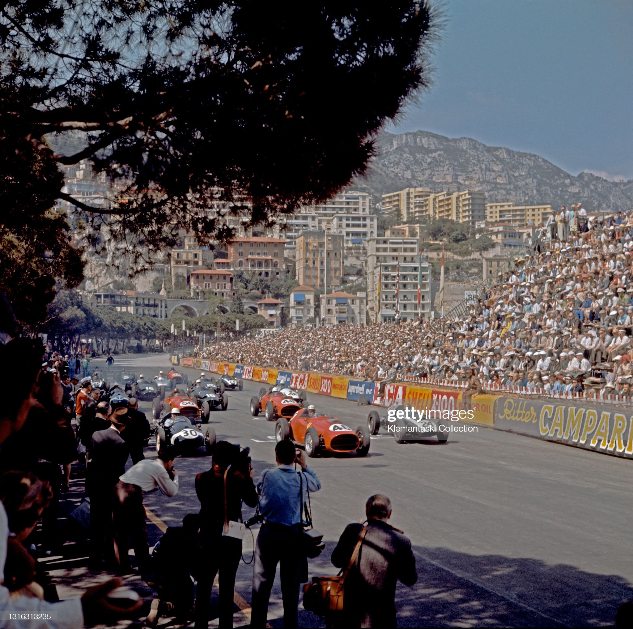 The start: (left to right) Stirling Moss (Cooper T45), Jean Behra (Ferrari 256F1) and Jack Brabham (Cooper T51) form the front row, Monaco Grand Prix.