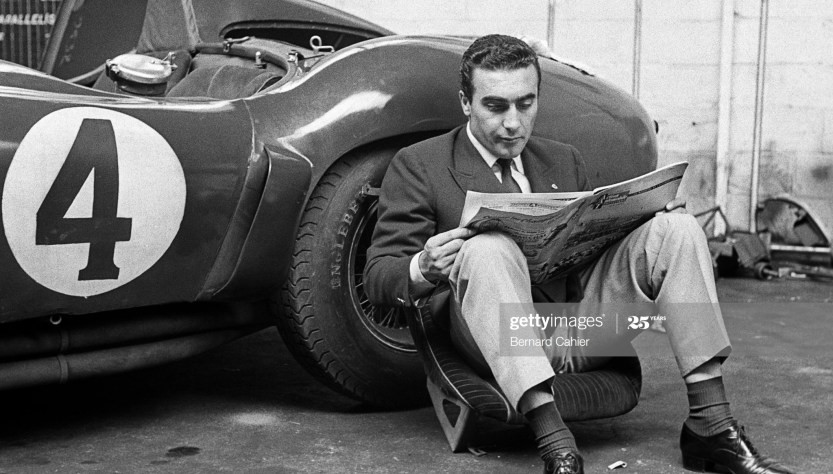 Eugenio Castellotti reading a newspaper.