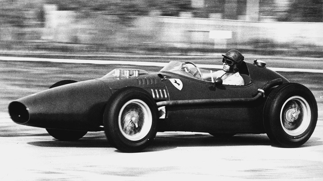 Peter Collins driving a Ferrari.