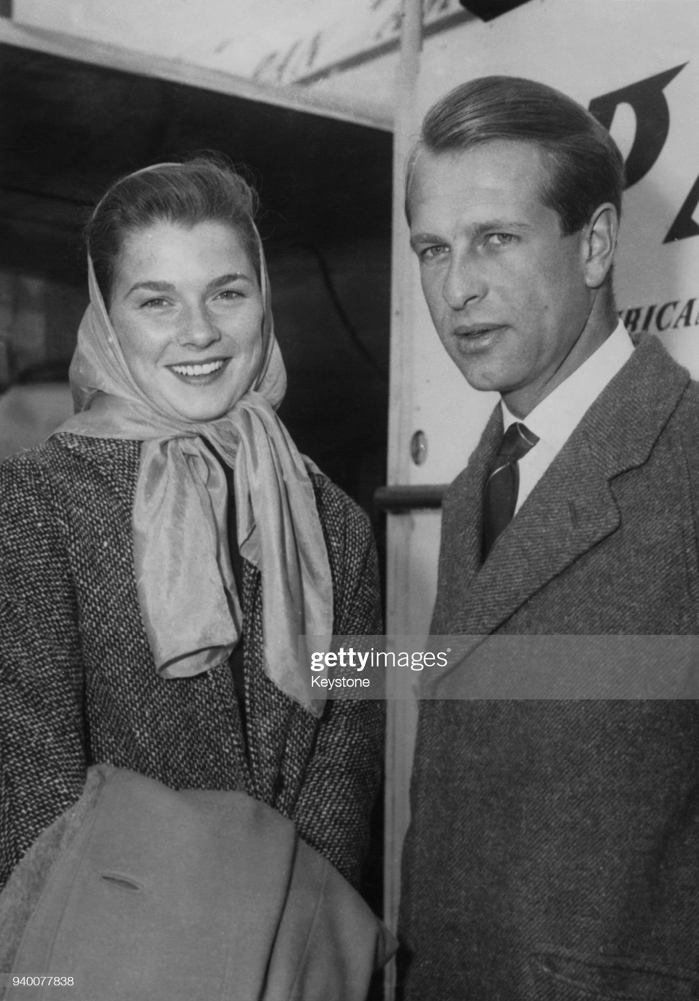 Peter Collins arrives at London Airport with his wife, actress Louise Cordier.