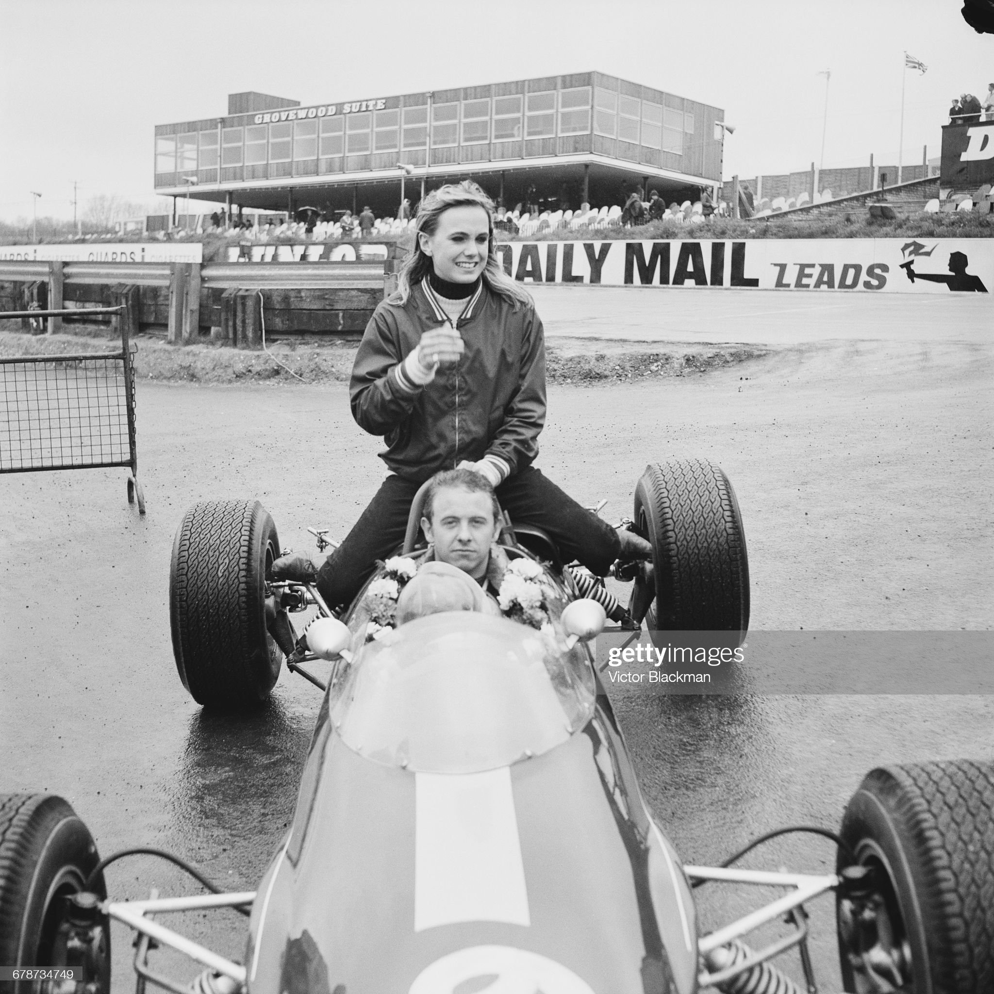 Piers Courage and his wife Lady Sarah Curzon, also known as Sally, sit aboard the Charles Lucas Team Lotus Lotus 41 Ford Cosworth.