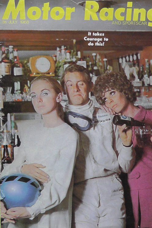 Piers Courage tackles a very silly photo shoot in a pub in 1968, modelling a classic two-piece racing suit. The lady model carrying his helmet is his wife Sally. 