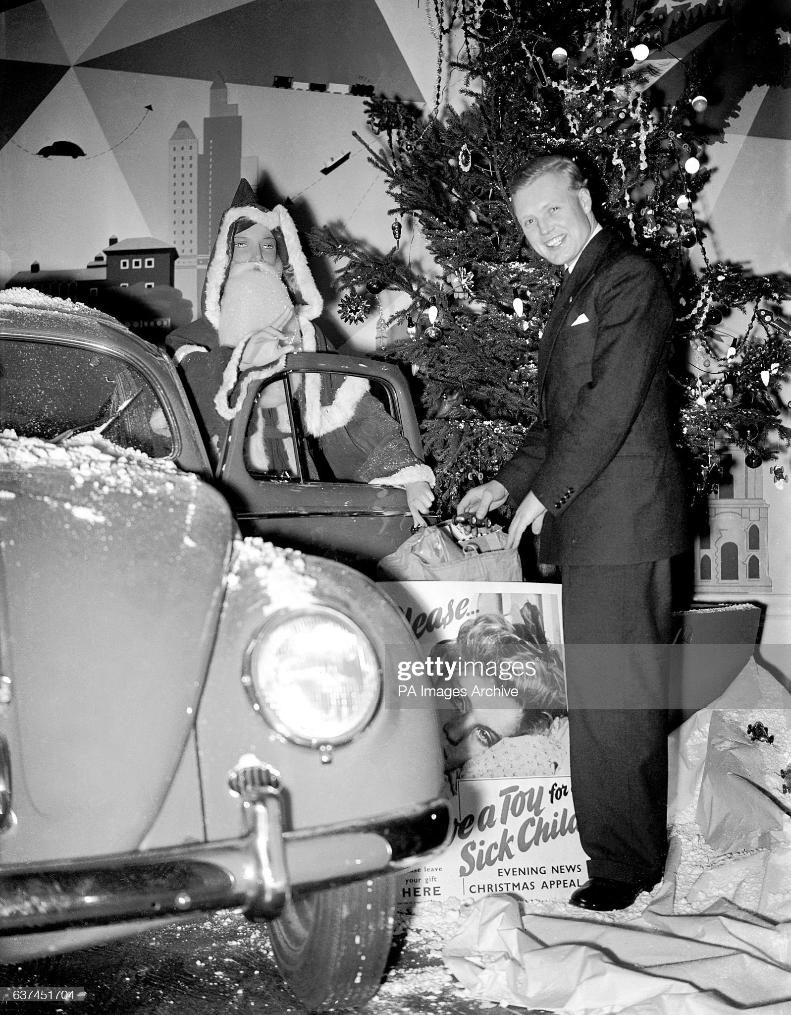 Mike Hawthorn opens the appeal, with a bit of help from a familiar character in a Volkswagen Beetle, on December 08, 1953. 