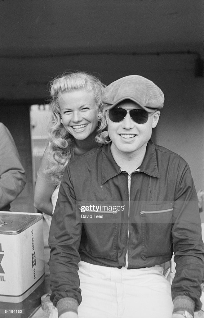 Mike Hawthorn with a female friend at Monza.