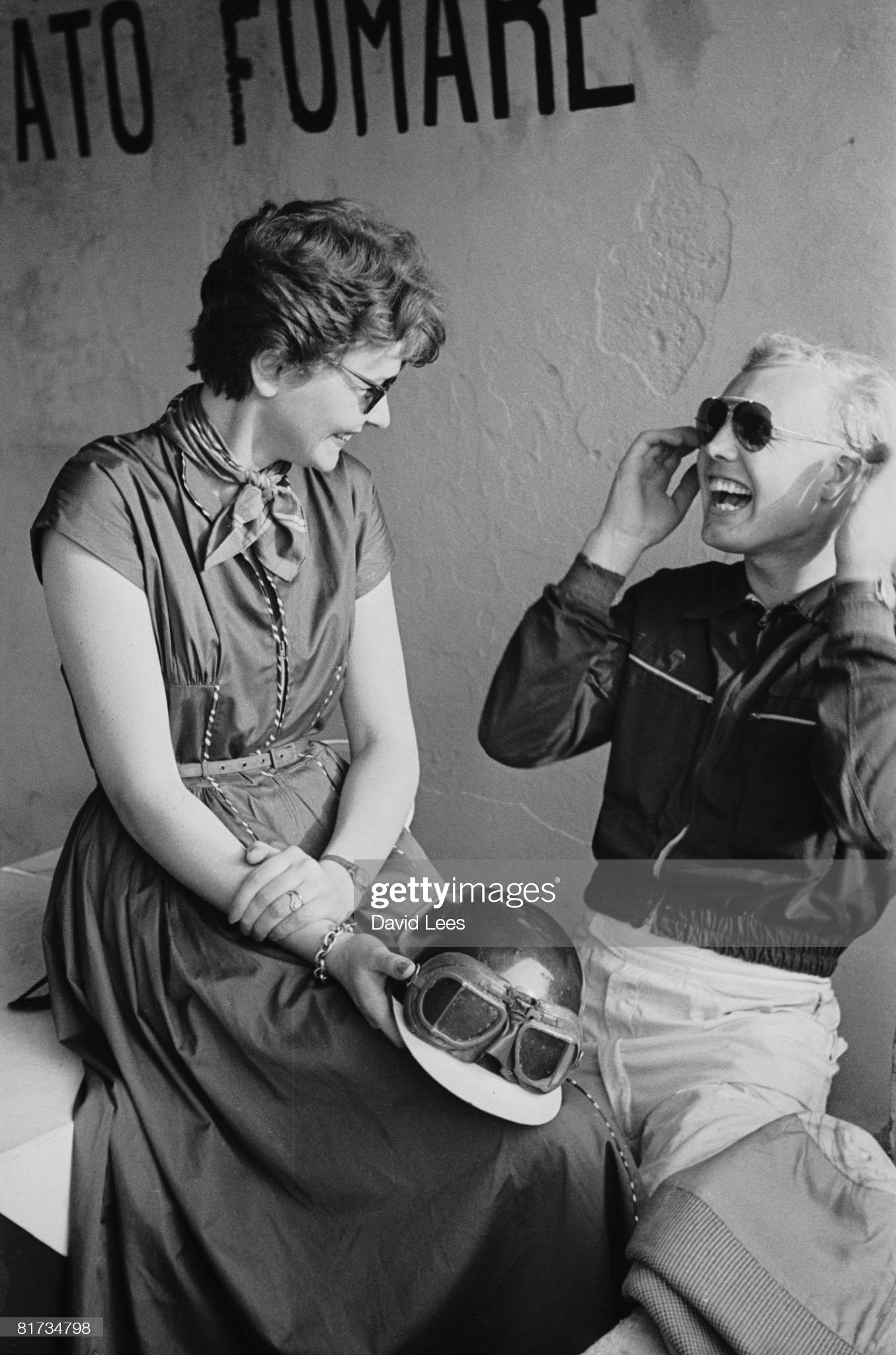 Mike Hawthorn with a girl at the Monza Grand Prix.