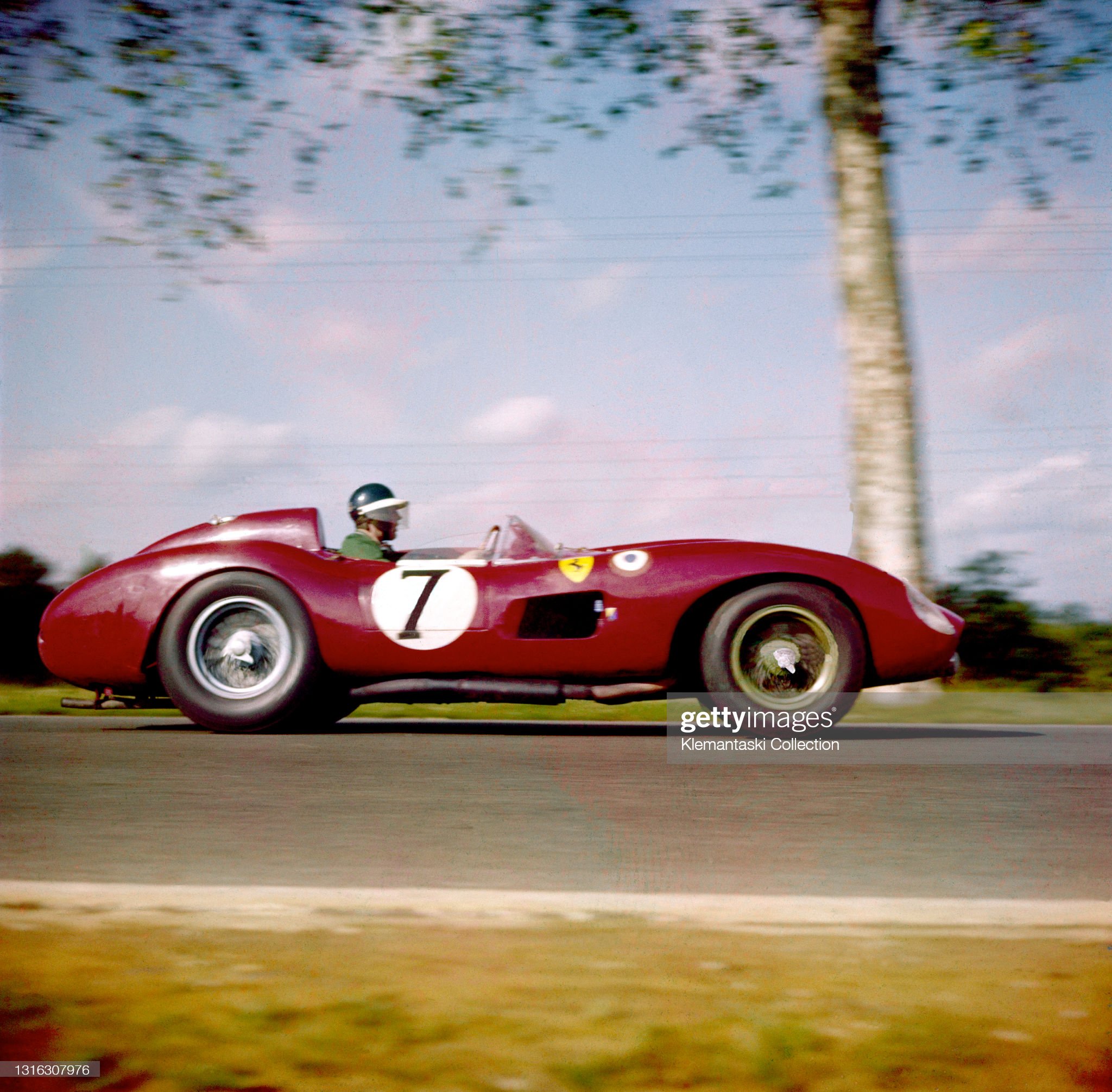 Mike Hawthorn on the Mulsanne Straight in his Ferrari 335 Sport, shared with Luigi Musso.