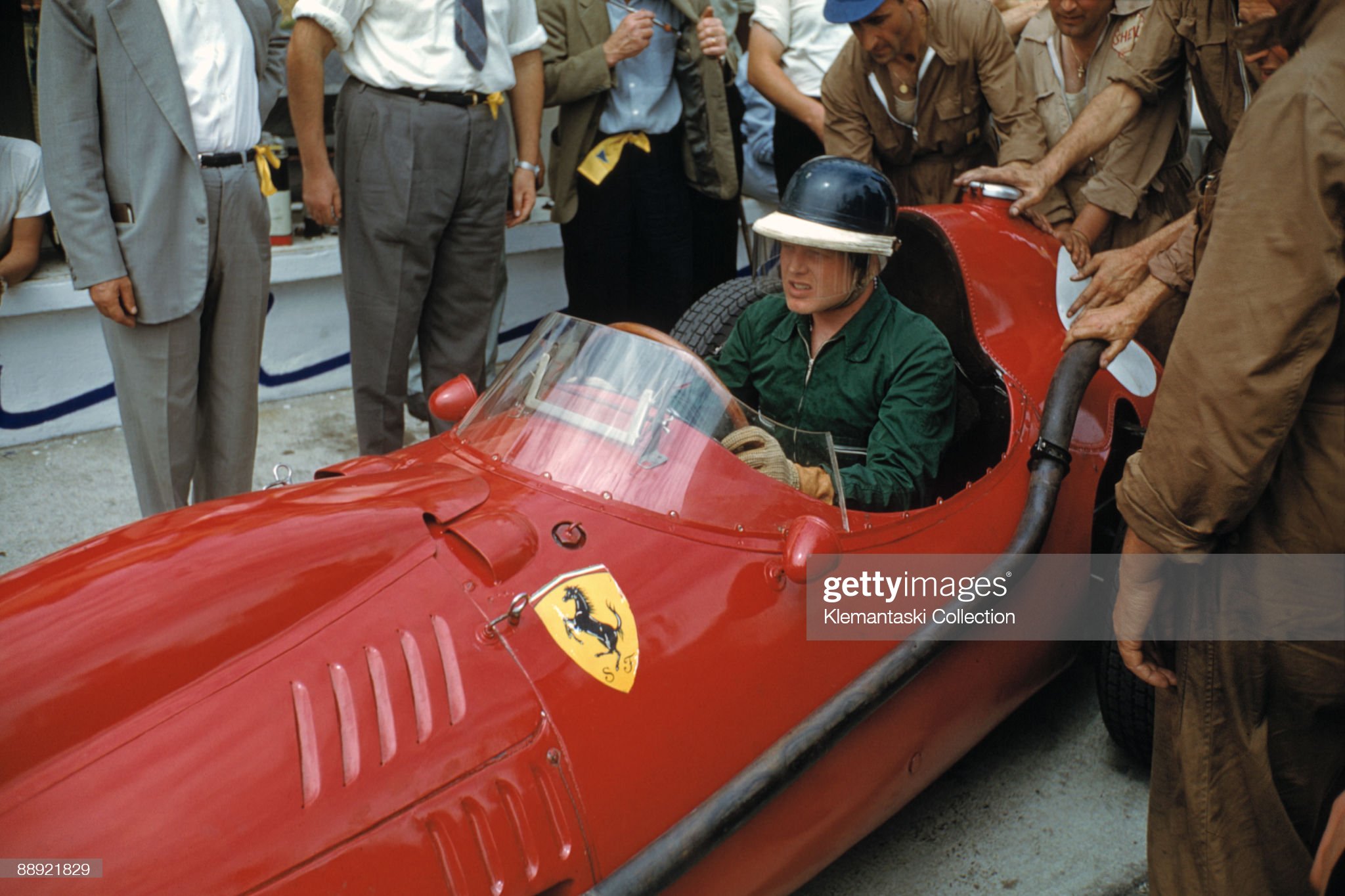 The German Grand Prix, Nürburgring, August 03, 1958. Mike Hawthorn is pushed off for practice in his Ferrari 246/F1. 