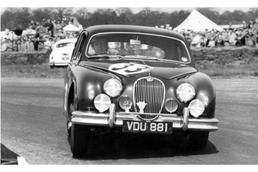 Mike Hawthorn driving his Jaguar.
