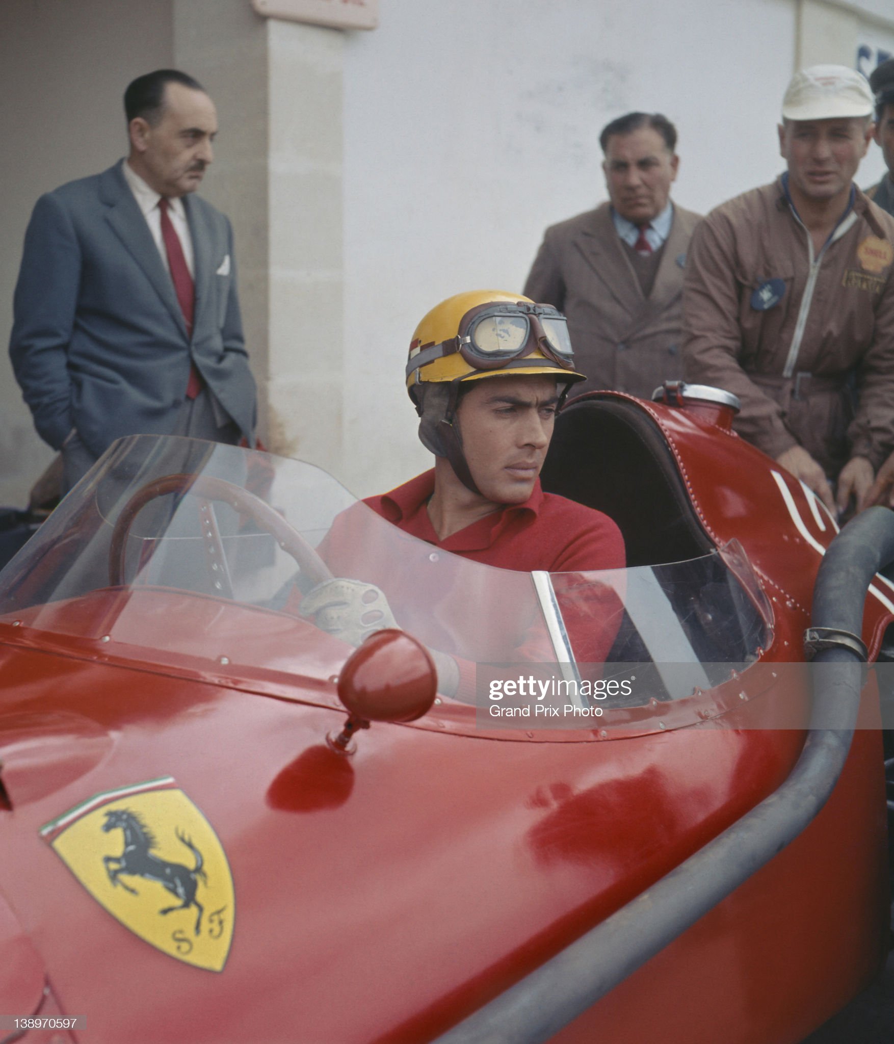 Luigi Musso sits aboard the n. 10 Ferrari 801 in the pits during practice for the French Grand Prix on 6th July 1957 at the Rouen-Les-Essarts circuit in Rouen, France. 