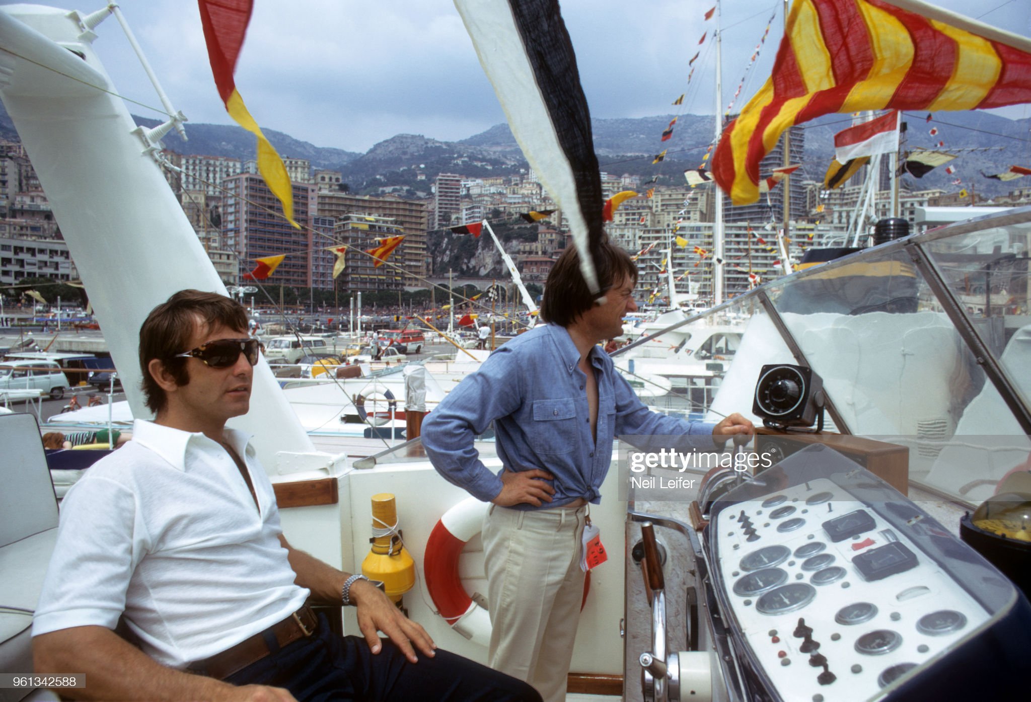 Peter Revson on a boat in the harbor at Circuit de Monaco.