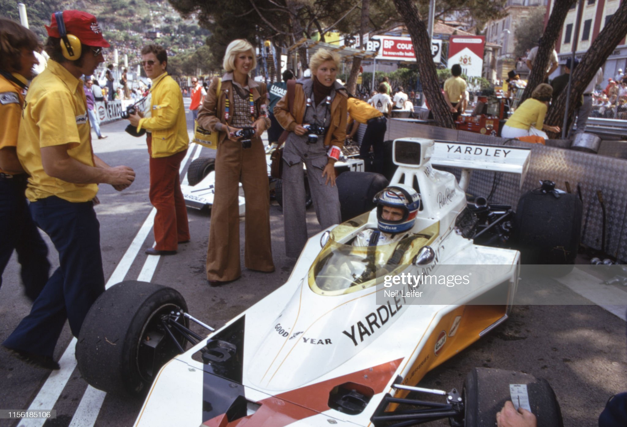 Peter Revson with photographers and crew before the start of race at Circuit de Monaco.