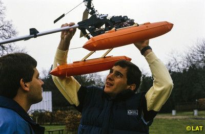 Ayrton and Maurício Gugelmin with a model helicopter in the backyard of their home in Esher, England in 1985.