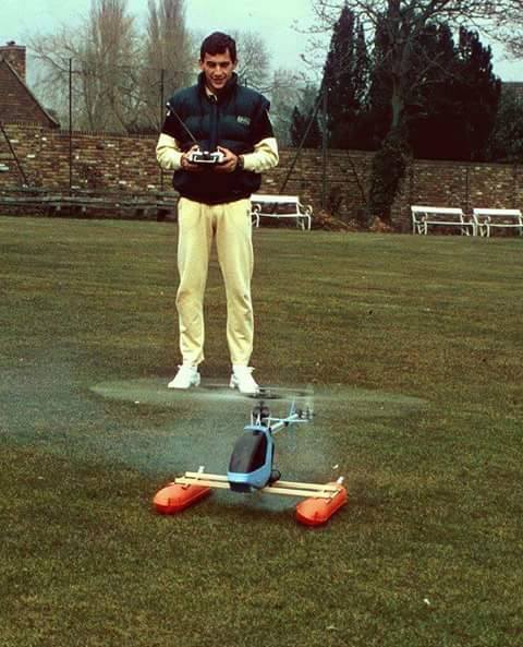 Ayrton Senna with a model helicopter in the backyard of his home in Esher, England in 1985.
