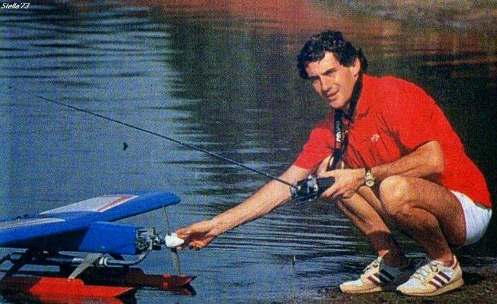 Ayrton Senna playing with a model plane.