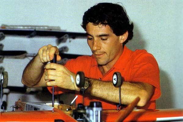 Ayrton Senna working on a model plane.