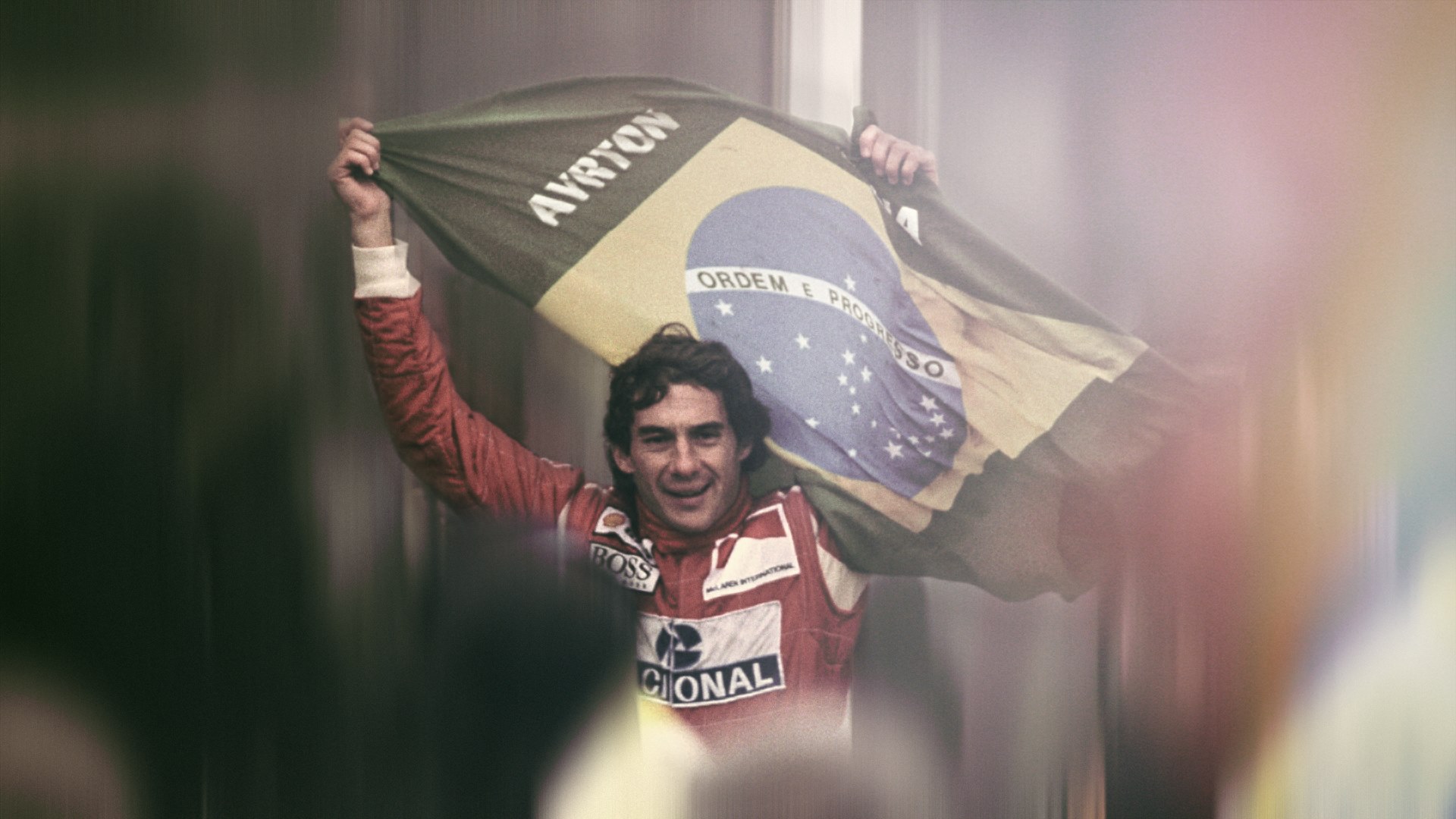 Ayrton Senna with a Brazilian flag.