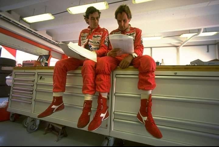 Ayrton Senna and Gerhard Berger in the McLaren pits.