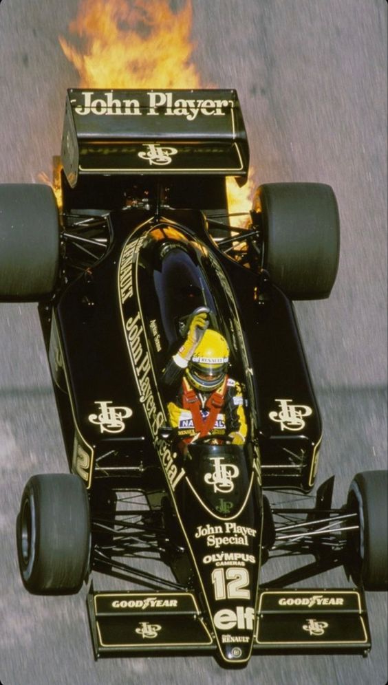 Ayrton Senna in a Lotus with a burning engine.