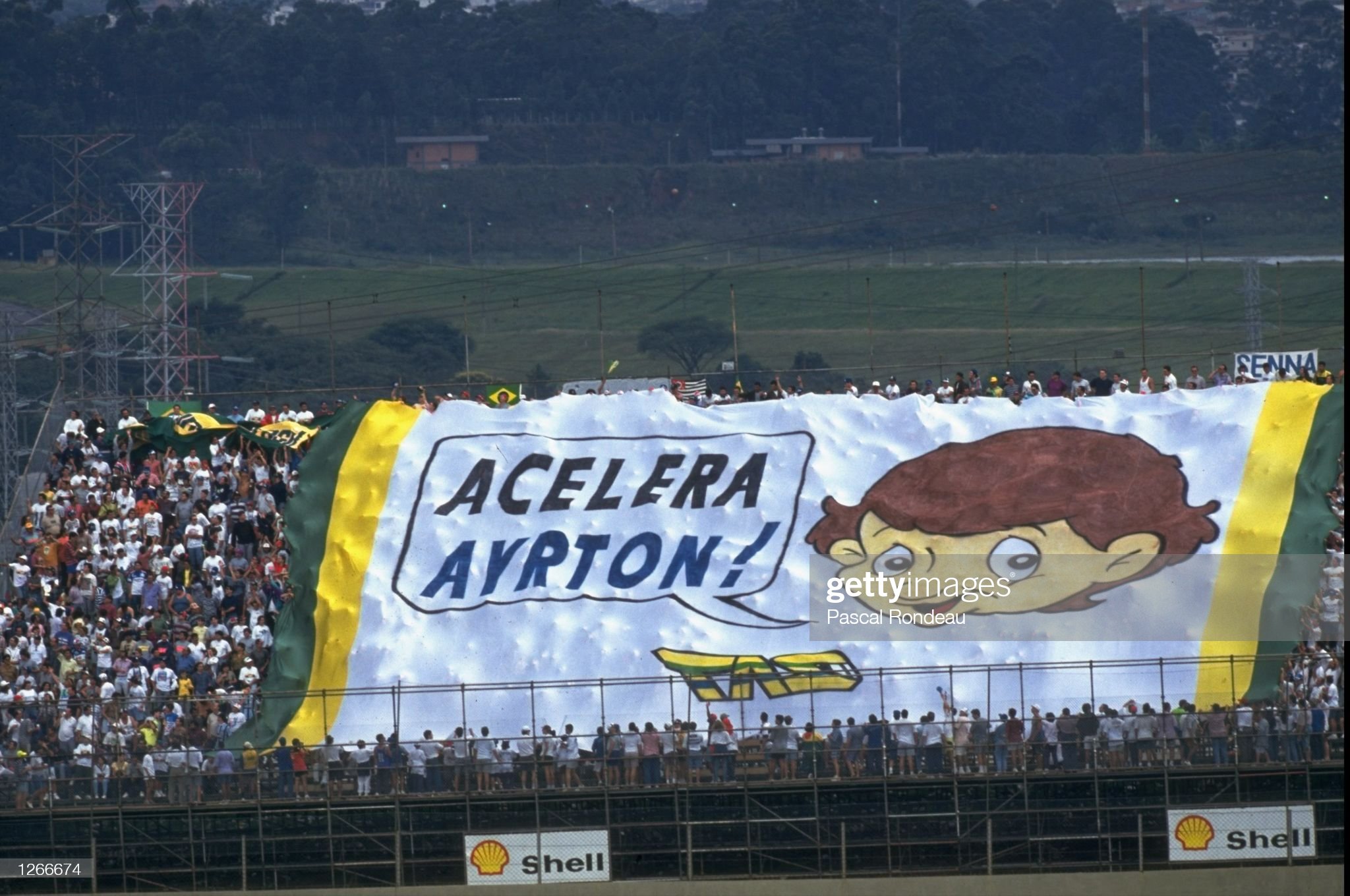 Fans hold a huge flag in support of Williams Renault driver Ayrton Senna during the Brazilian Grand Prix at the Interlagos circuit on March 27, 1994.