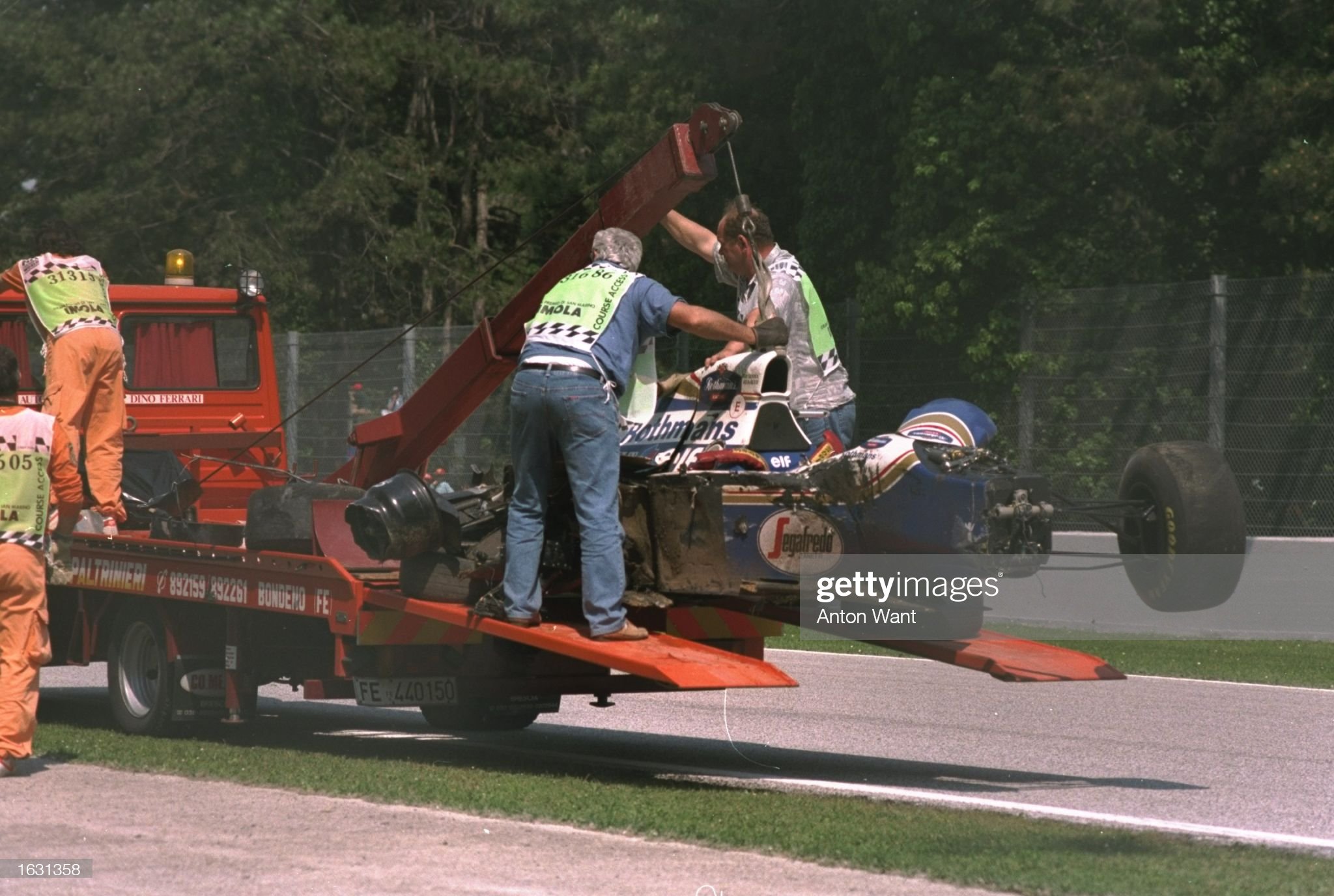 Ayrton Senna's Williams Renault is hauled off the circuit after Senna crashed during the San Marino Grand Prix at the Imola circuit on 01 May 1994.