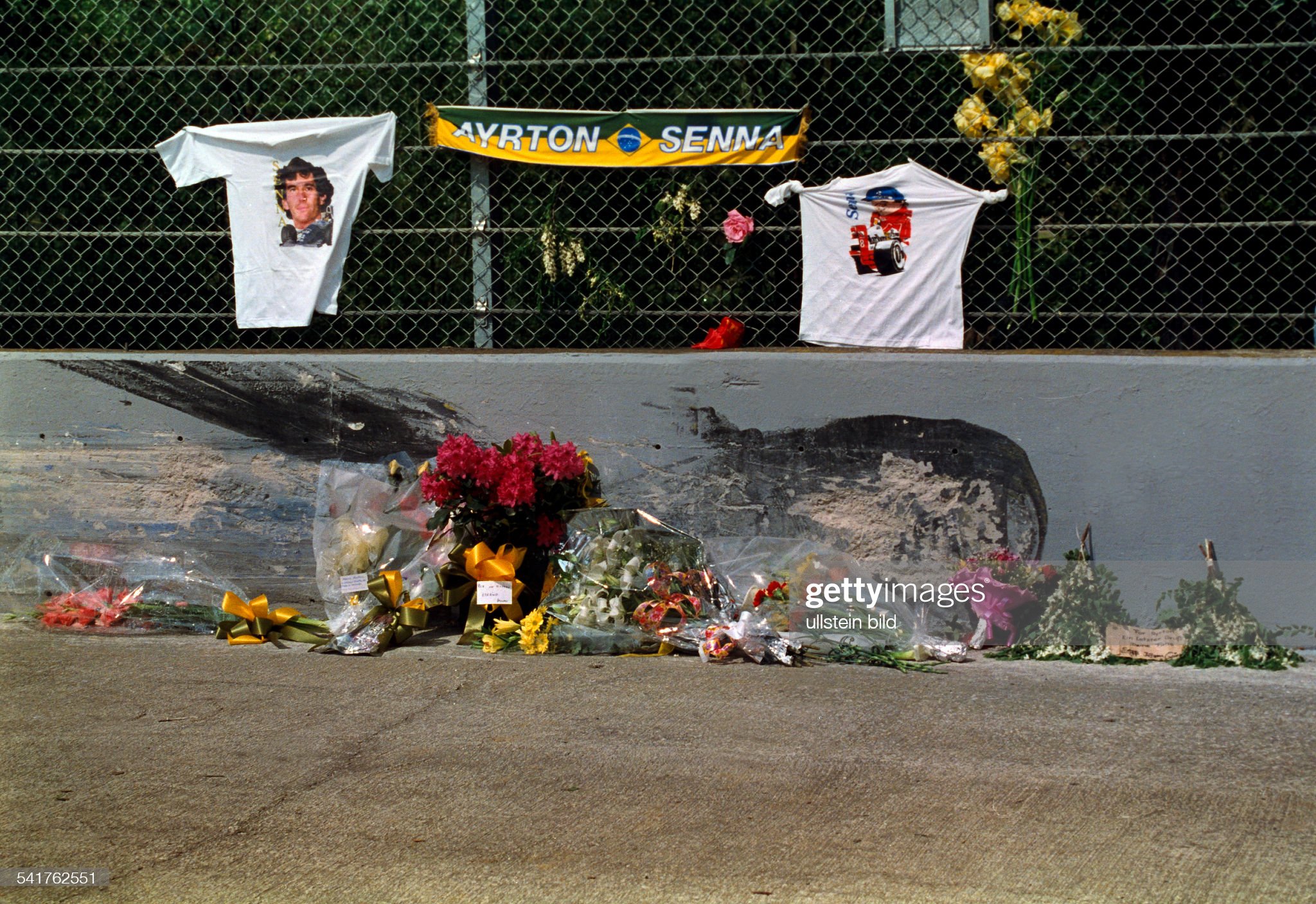 The scene of the accident of Ayrton Senna decorated with flowers by fans in the Tamburello curve on the Imola circuit where Senna died, August 01, 1994. 