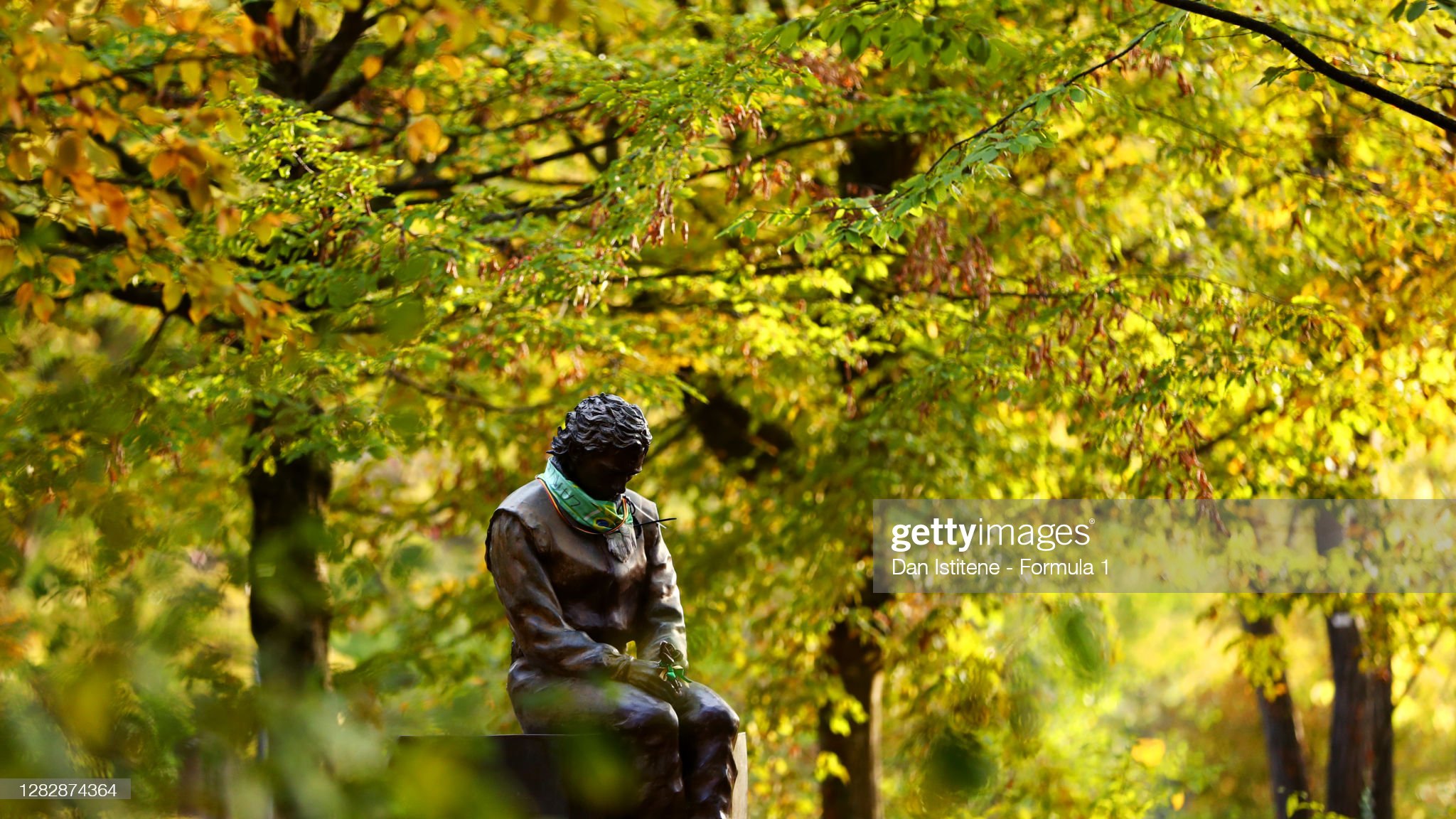 A bronze statute of Ayrton Senna at his memorial site near the Tamburello corner.