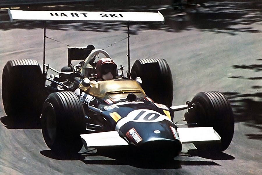 Jo Siffert driving a race car.