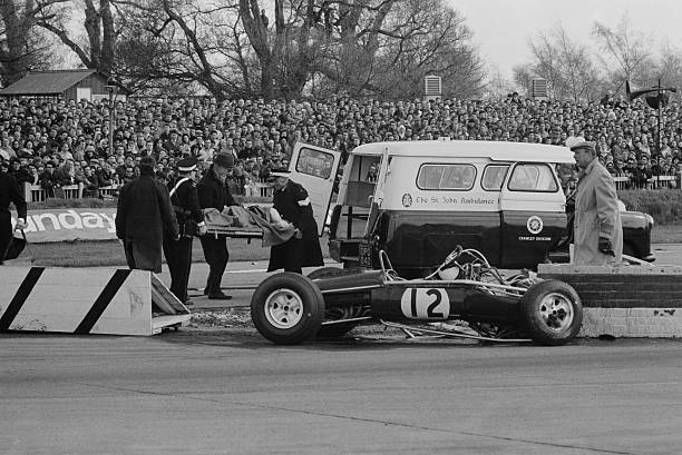 Jo Siffert is injured in a crash at Goodwood, UK and taken away by St John's Ambulance, 19th April 1965.