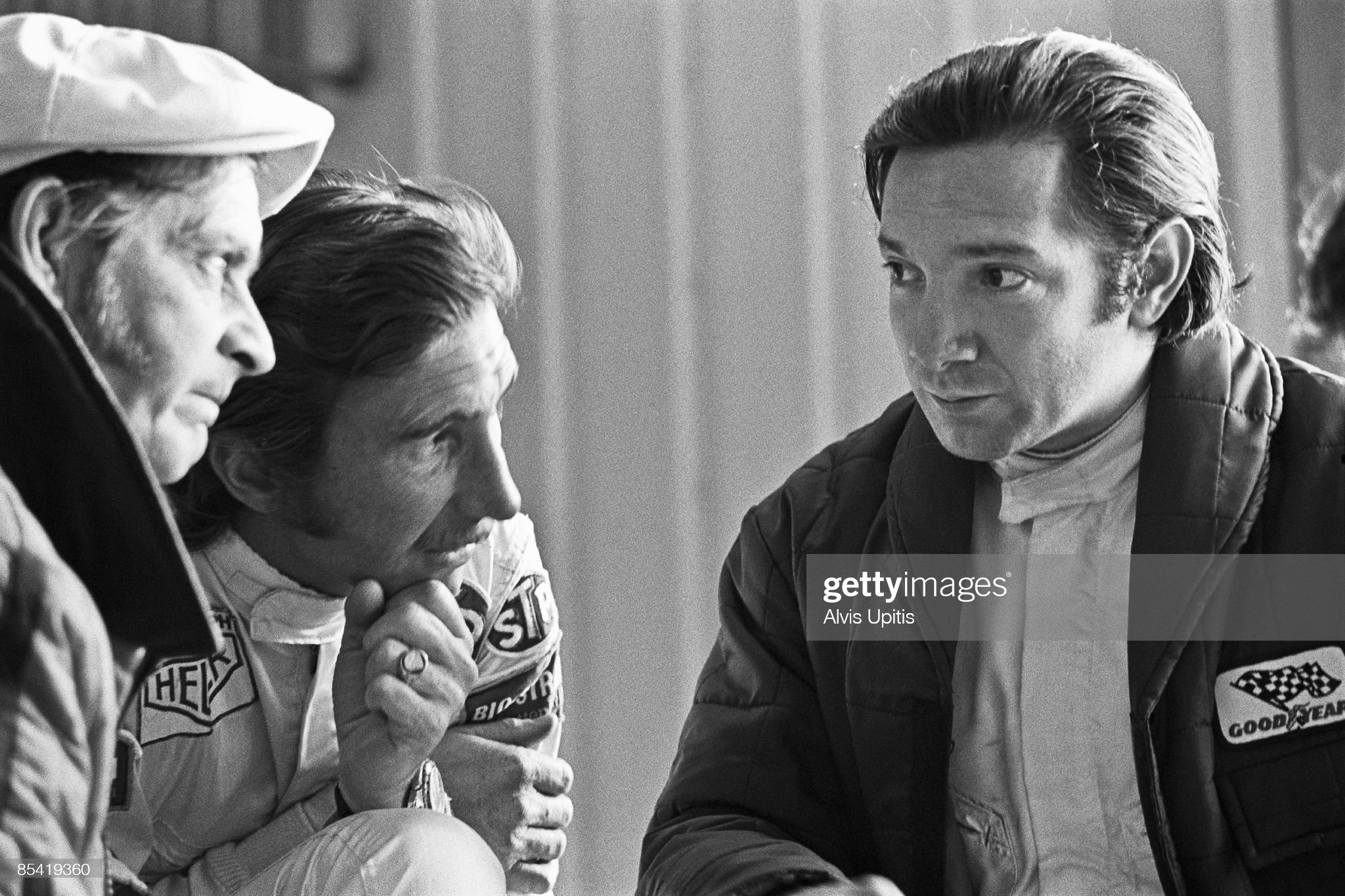 Pedro Rodriguez, right, talks with fellow Brabham driver Jo Siffert and mechanic.