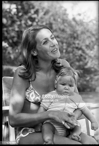 Simone, widow of Jo Siffert, with her son Philippe on July 01, 1973.