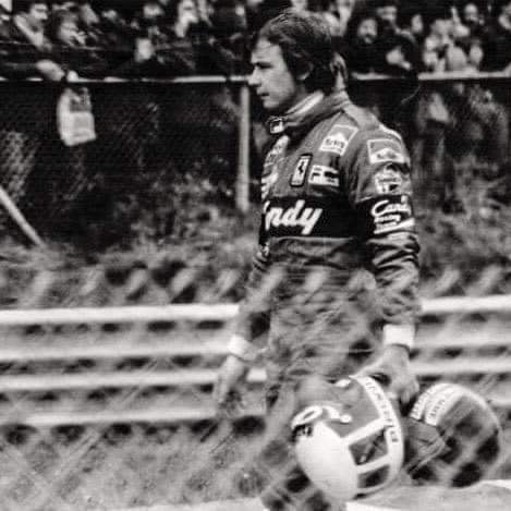 Zolder, May 08, 1982. Didier Pironi returns to the pits holding his helmet and that of Gilles Villeneuve.