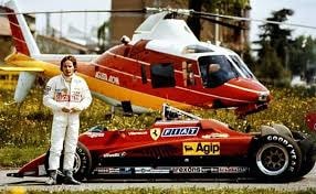 Gilles Villeneuve poses with the 126 C2 and the helicopter he personally pilots.