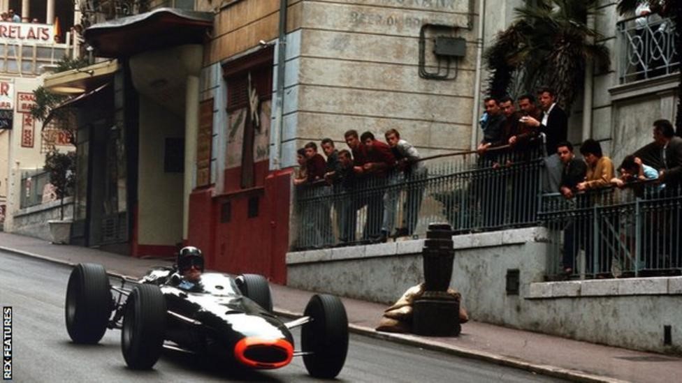 Fans watch 'Mr. Monaco' Graham Hill, Damon’s father, cruise by as he wins the 1965 Monaco Grand Prix.