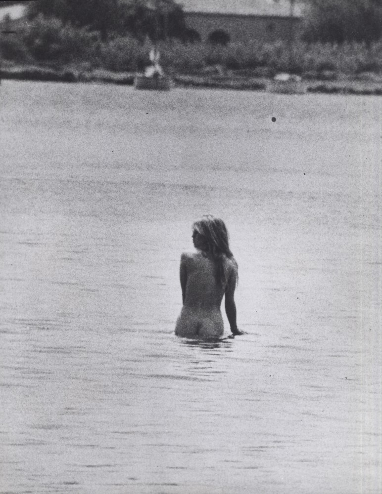 A naked Brigitte Bardot bathes in the sea.