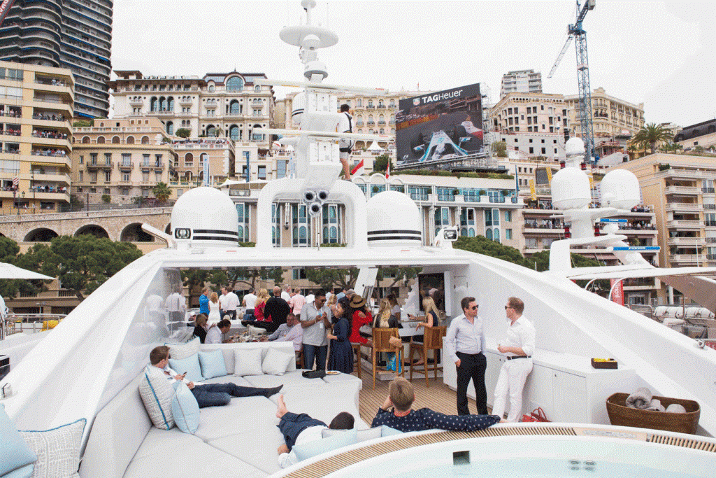 The rich and famous spectators often arrive on their boats and the yachts through the harbour.