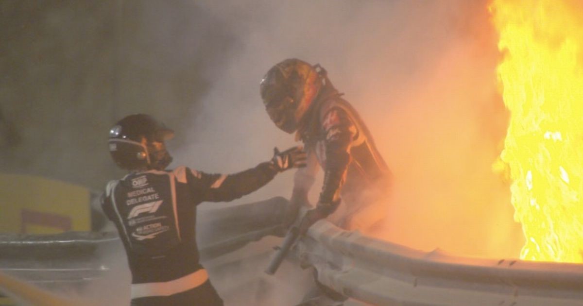 Romain Grosjean emerges from the flames.