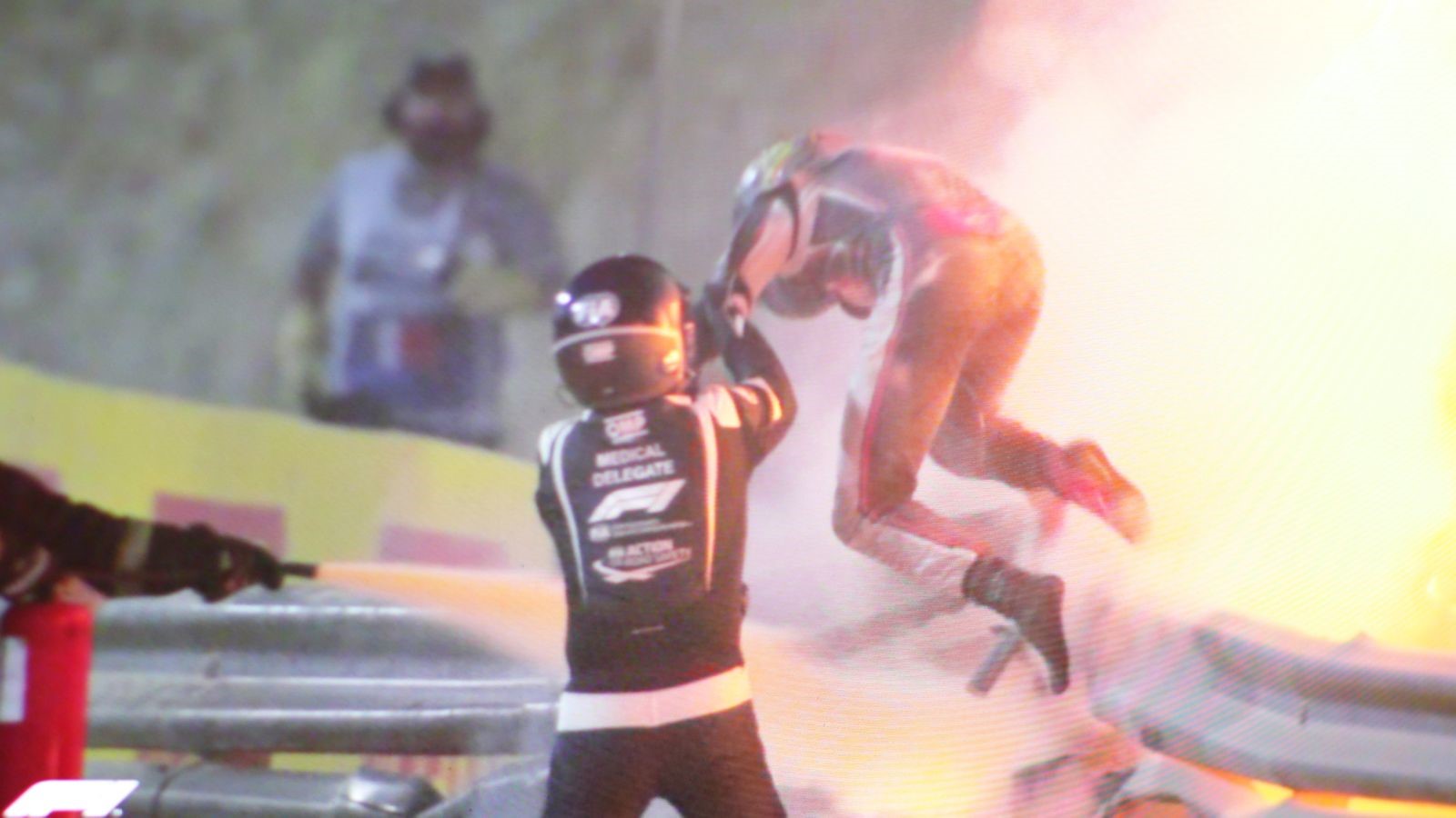 Romain Grosjean emerges from the flames.