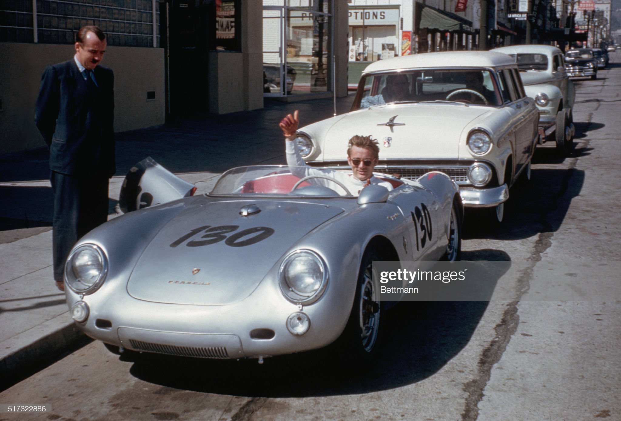 Actor James Dean gives a thumbs-up sign from his grey Porsche 550 Spyder, the Little Bastard, while parked on Vine Street in Hollywood on September 01,1955.