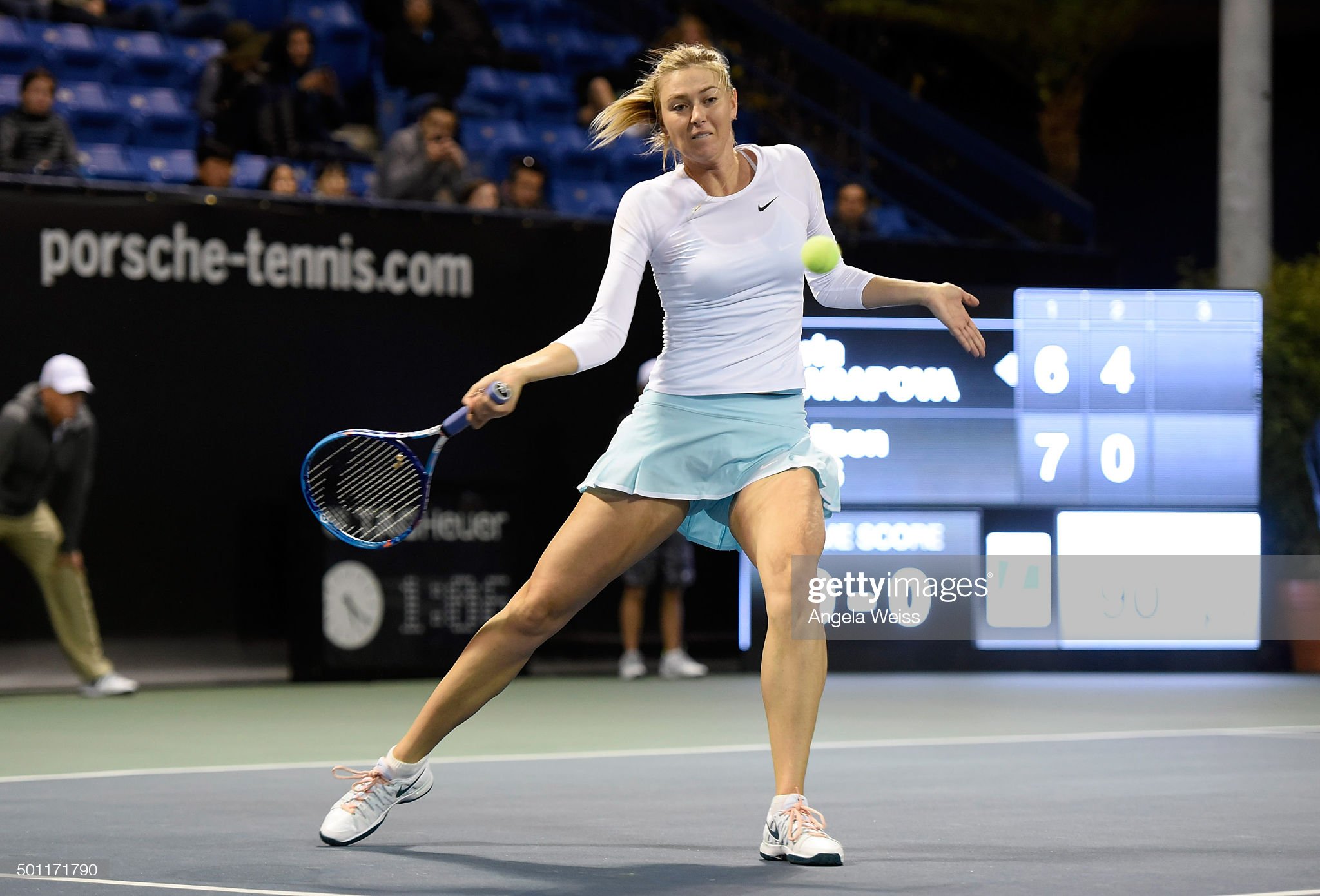 Maria Sharapova playing tennis.