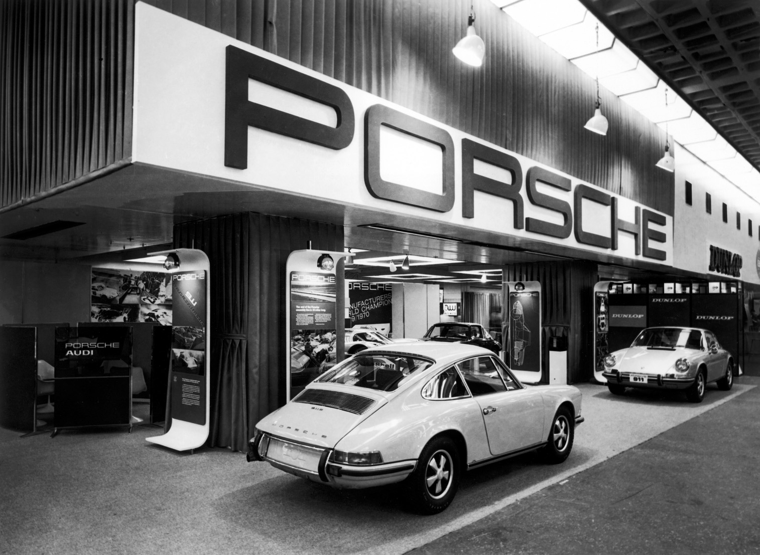 Two white Porsches 911.