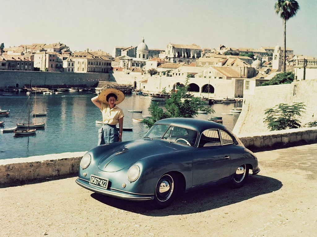 A woman and a Porsche 356. 
