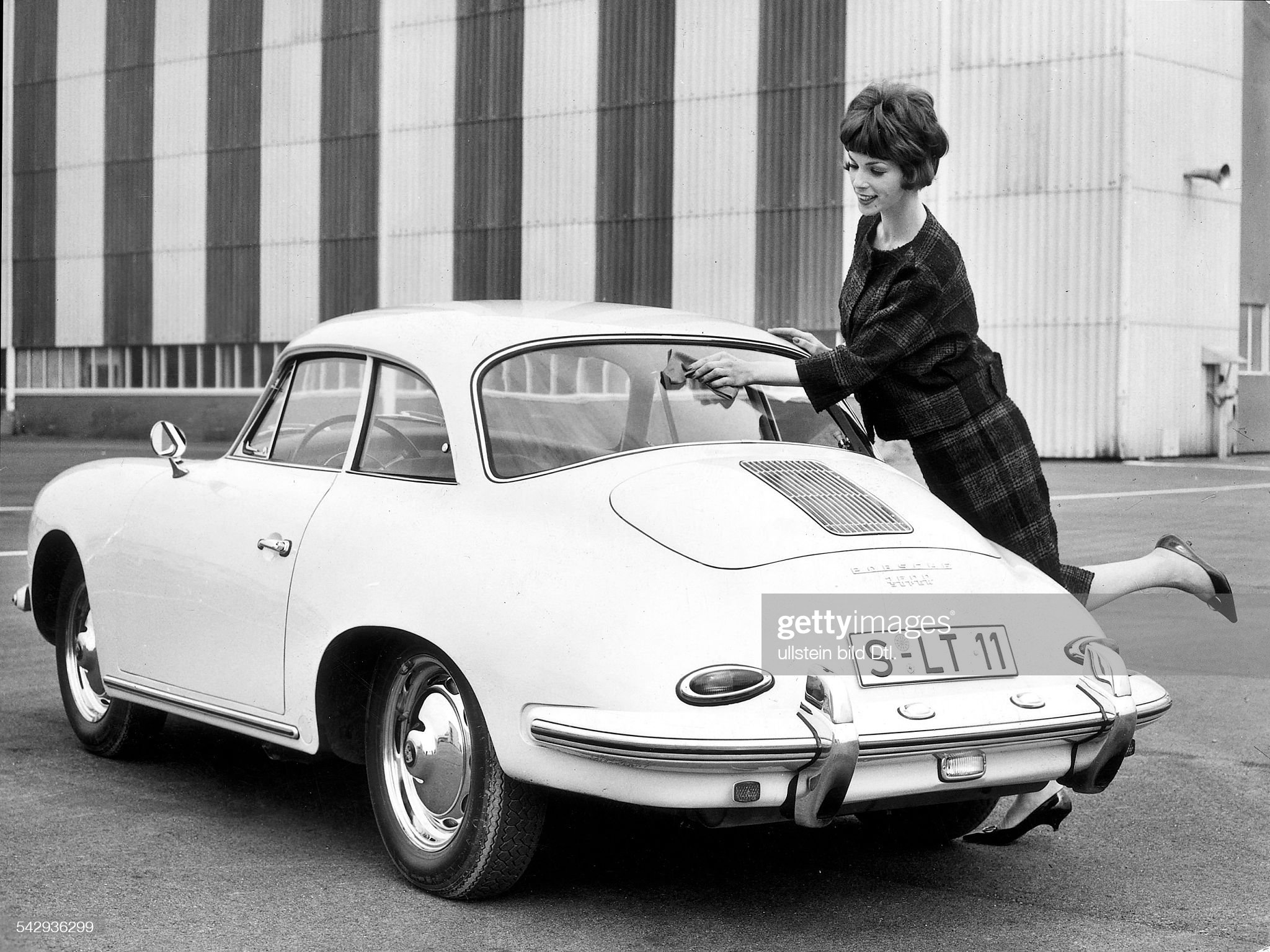 A young woman and a Porsche 356 in the early 1960s. 