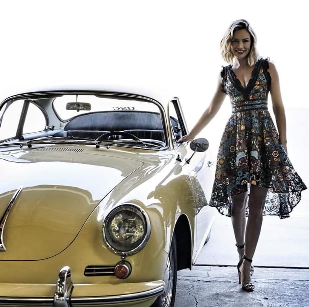 A girl with a Porsche 356.