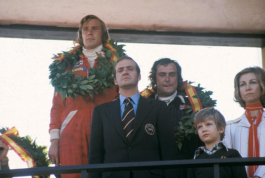 1976. Podium ceremony for James Hunt, winner of the Spanish Grand Prix, with third placed Gunnar Nilsson. In front of him Juan Carlos, King of Spain, his wife Sophia and Prince Felipe. 