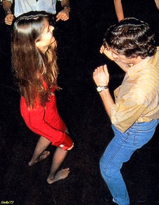 Ayrton dancing with Carol at a party.