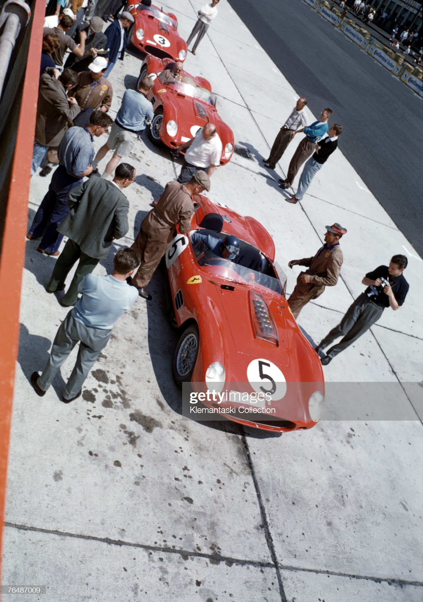 Cliff Allison settles into the cockpit of the Ferrari TR59 he is to share with Dan Gurney during the Nurburgring 1000 km Race at the Nurburgring circuit, 7th June 1959. This was a strong lineup of Ferraris, but they we