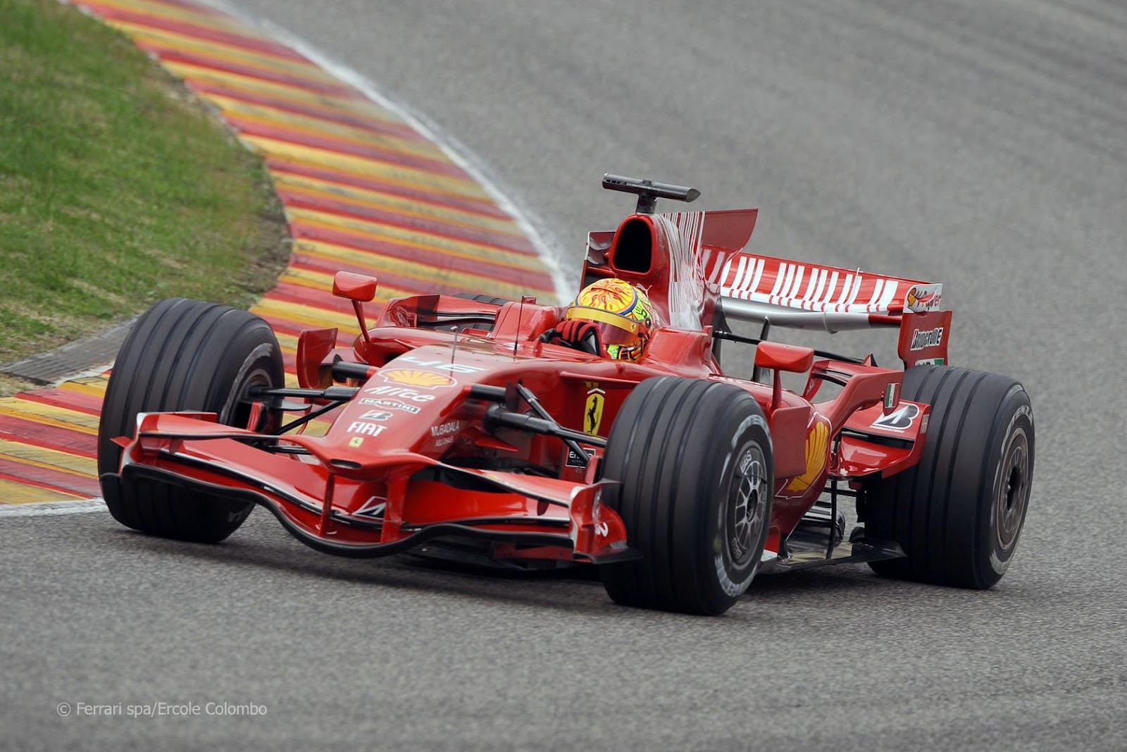 Valentino Rossi driving a Ferrari.