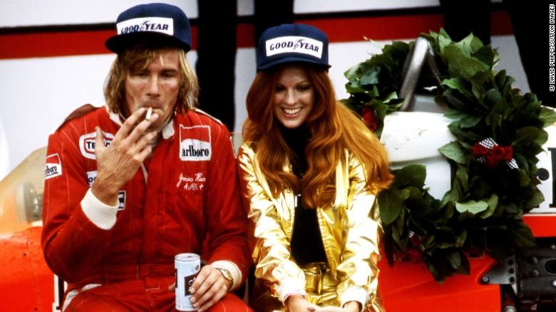 The unforgettable James Hunt savors victory at Watkins Glen in 1977 with a girl.
